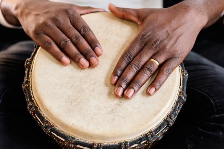 musician playing drums with his hands