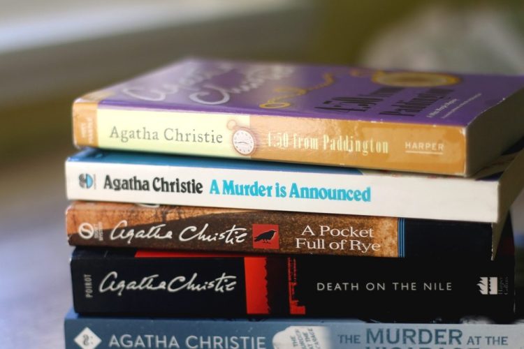 stack of classic murder mystery books by Agatha Christie