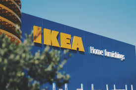 image of the front of an Ikea Home Furniture store with part of a tree blocking it