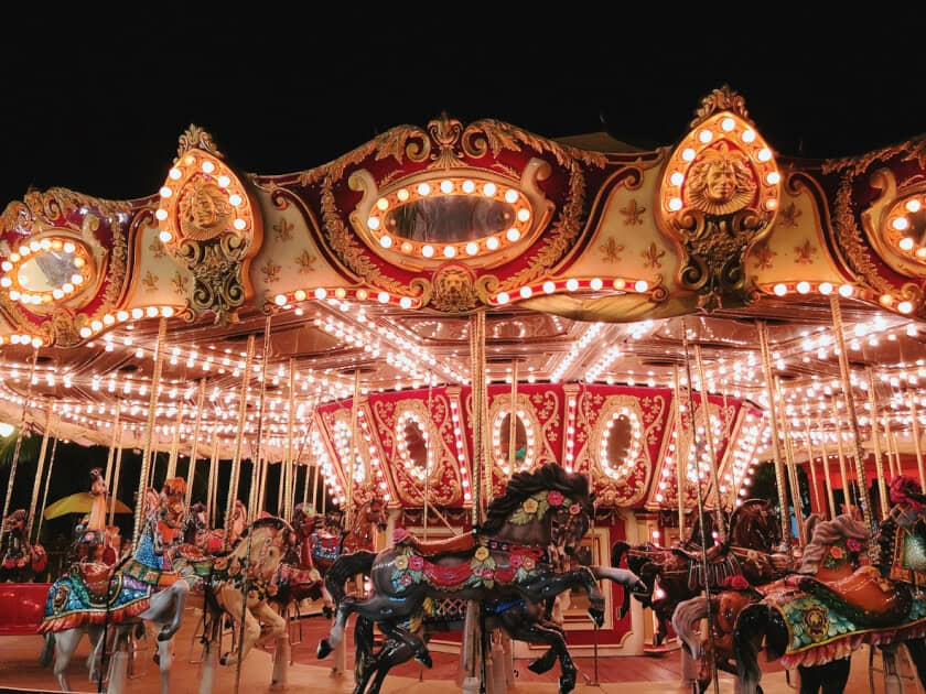 Photo of a merry-go-round in a carnival at night