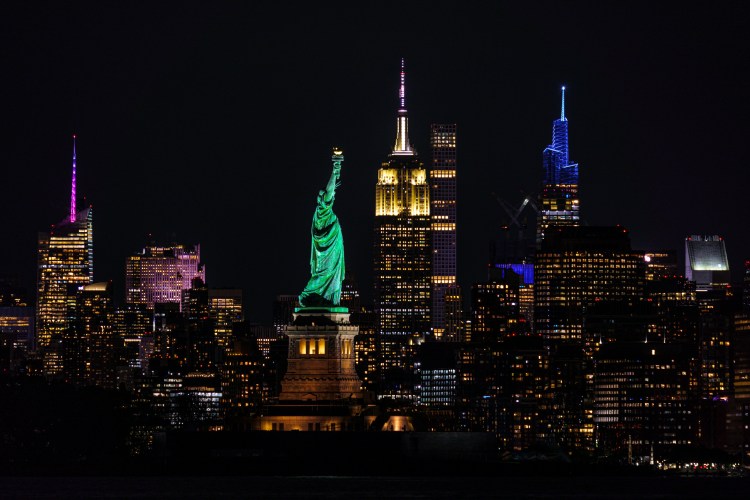 photo of the NYC skyline with the statue of liberty