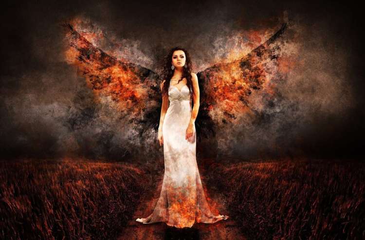 Image of a woman in a white dress with burning wings spread out behind her. The crops around her are burning and the sky is ash and smoke